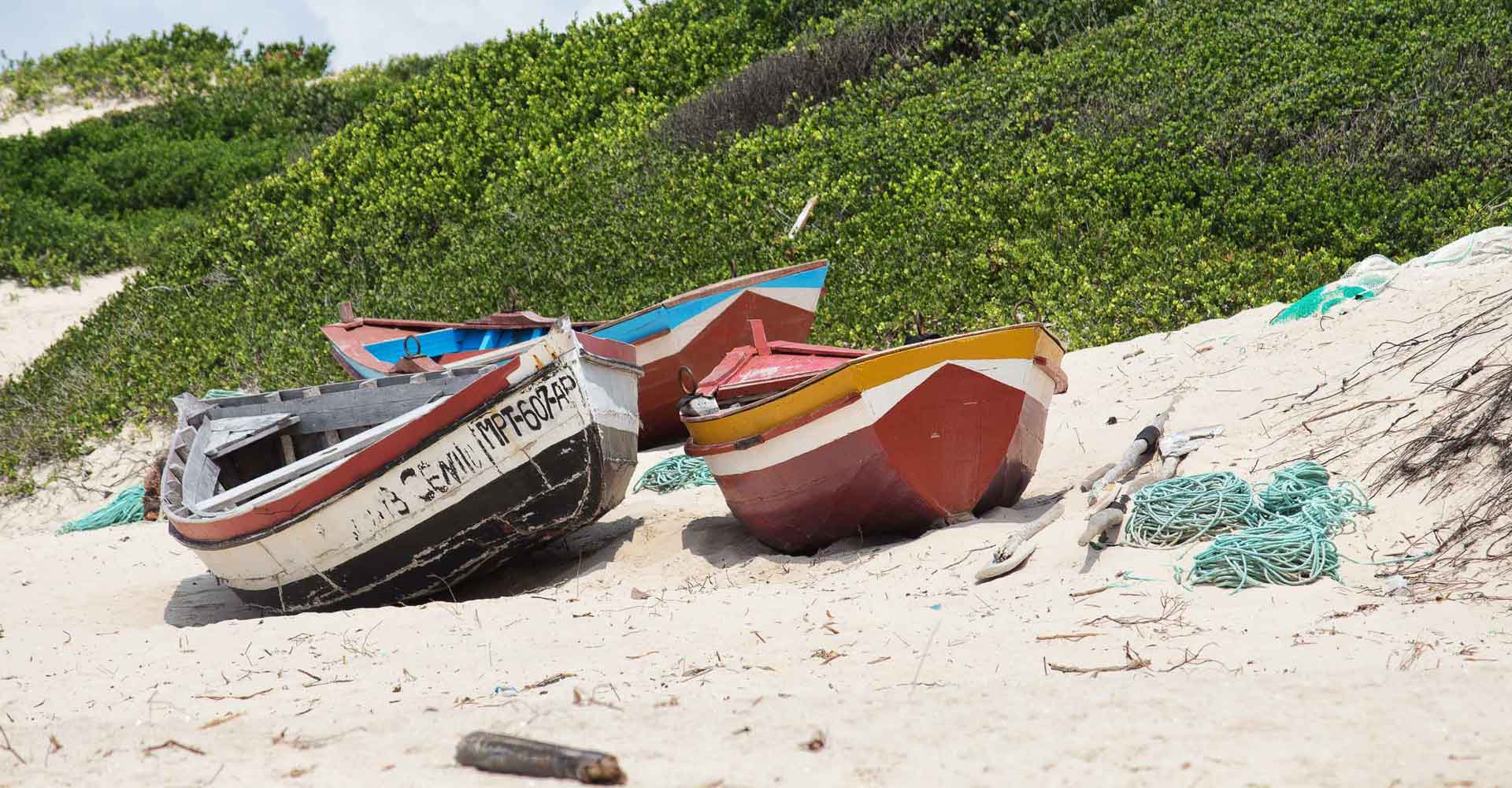 Traditional boats in Macaneta beach by mabeco tours from Maputo